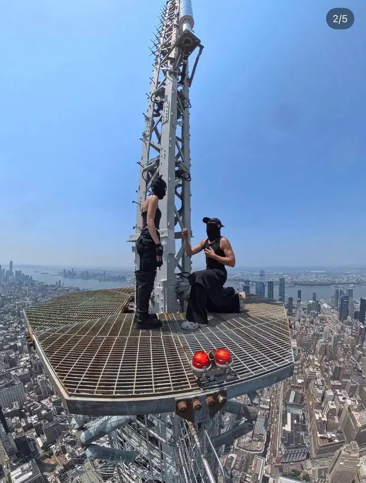 A couple who climbed to the top of the Empire State Building to propose have been arrested